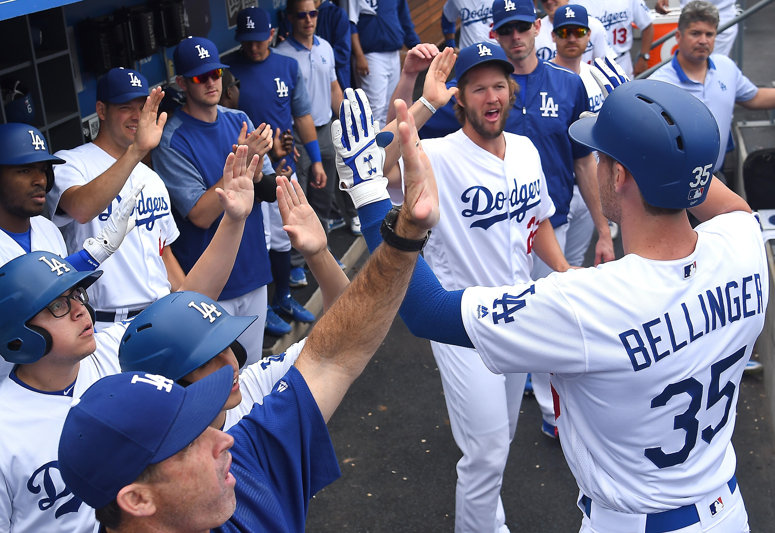 LOS ANGELES, CA - JUNE 11:  Cody Bellinger #35 of the Los Angeles Dodgers is greeted in the dugout after a two run home run in the second inning of the game against the Cincinnati Reds at Dodger Stadium on June 11, 2017 in Los Angeles, California.  (Photo