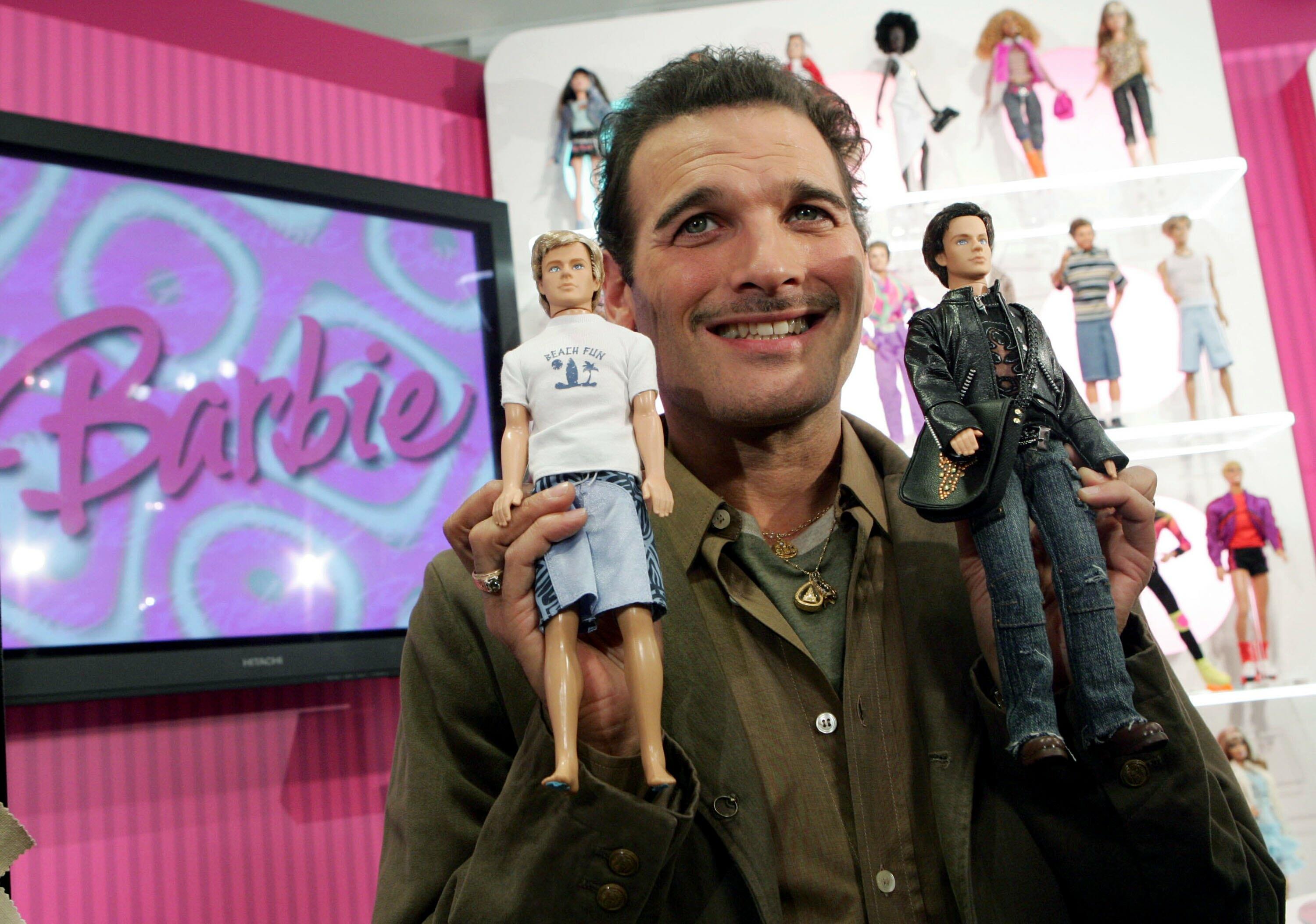 NEW YORK - FEBRUARY 9:  In this handout photo released by Mattel, celebrity stylist Phillip Bloch unveils the new Ken dolls February 9, 2006 in New York City. The doll at left, which will be available on March 1 nationwide, reflects Ken's beach boy roots.