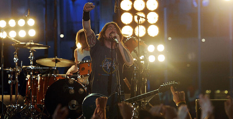 LOS ANGELES, CA - FEBRUARY 12:  Musician Dave Grohl (C) of the Foo Fighters performs onstage at the 54th Annual GRAMMY Awards held at Staples Center on February 12, 2012 in Los Angeles, California.  (Photo by Jason Merritt/Getty Images)