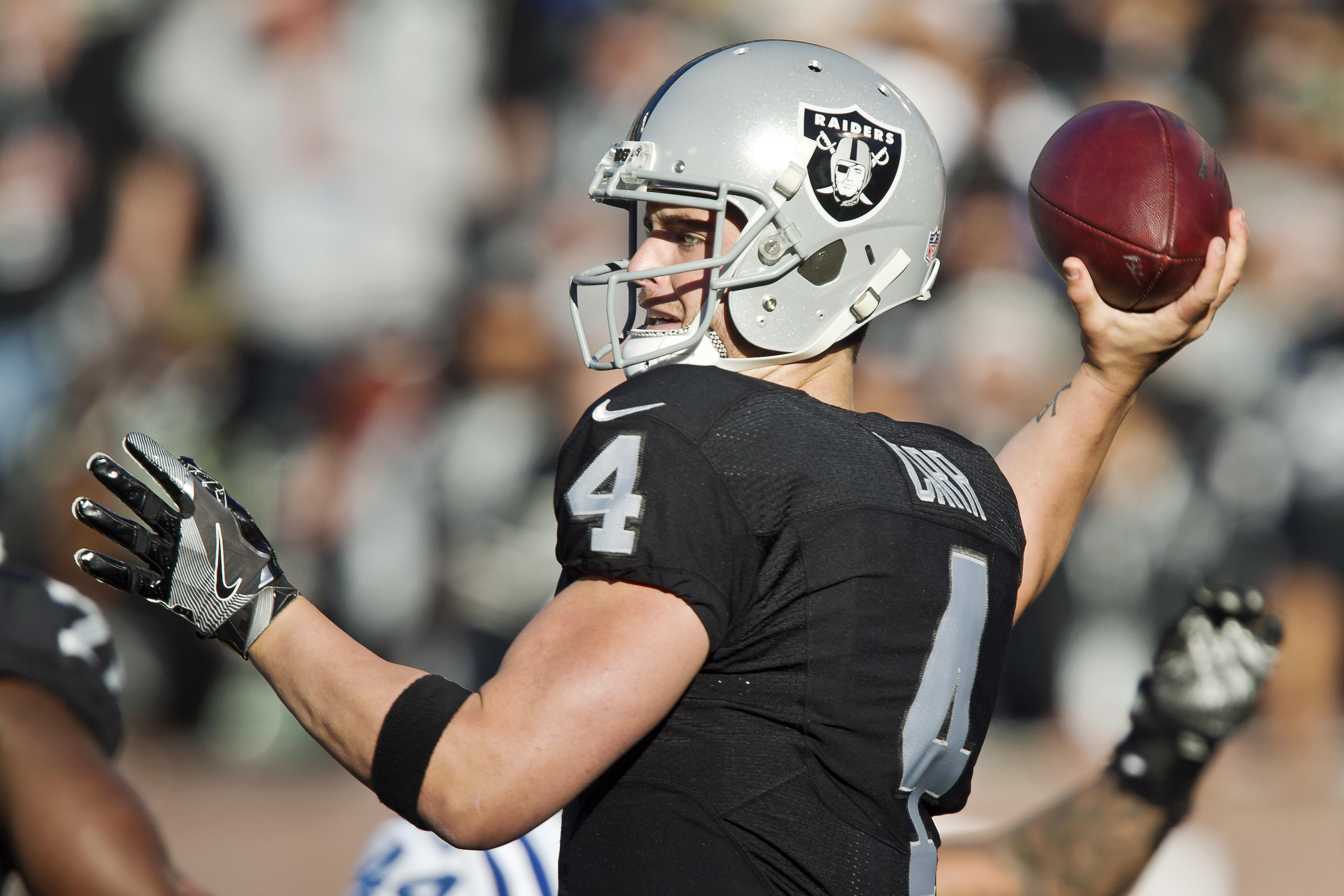 OAKLAND, CA - DECEMBER 24:  Quarterback Derek Carr #4 of the Oakland Raiders throws the ball against the Indianapolis Colts in the third quarter on December 24, 2016 at Oakland-Alameda County Coliseum in Oakland, California.  The Raiders won 33-25.  (Phot