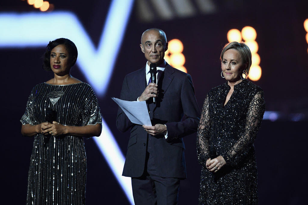 LONDON, ENGLAND - FEBRUARY 22:  (EDITORIAL USE ONLY) (L-R)  Pepsi DeMacque, Andrew Ridgeley and Shirlie Holliman present a tribute to George Michael on stage at The BRIT Awards 2017 at The O2 Arena on February 22, 2017 in London, England.  (Photo by Gareth Cattermole/Getty Images)