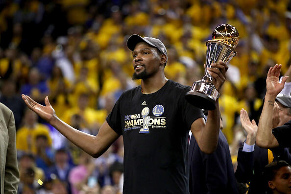 OAKLAND, CA - JUNE 12:  Kevin Durant #35 of the Golden State Warriors celebrates after being named Bill Russell NBA Finals Most Valuable Player after defeating the Cleveland Cavaliers 129-120 in Game 5 to win the 2017 NBA Finals at ORACLE Arena on June 12, 2017 in Oakland, California. NOTE TO USER: User expressly acknowledges and agrees that, by downloading and or using this photograph, User is consenting to the terms and conditions of the Getty Images License Agreement.  (Photo by Ezra Shaw/Getty Images)