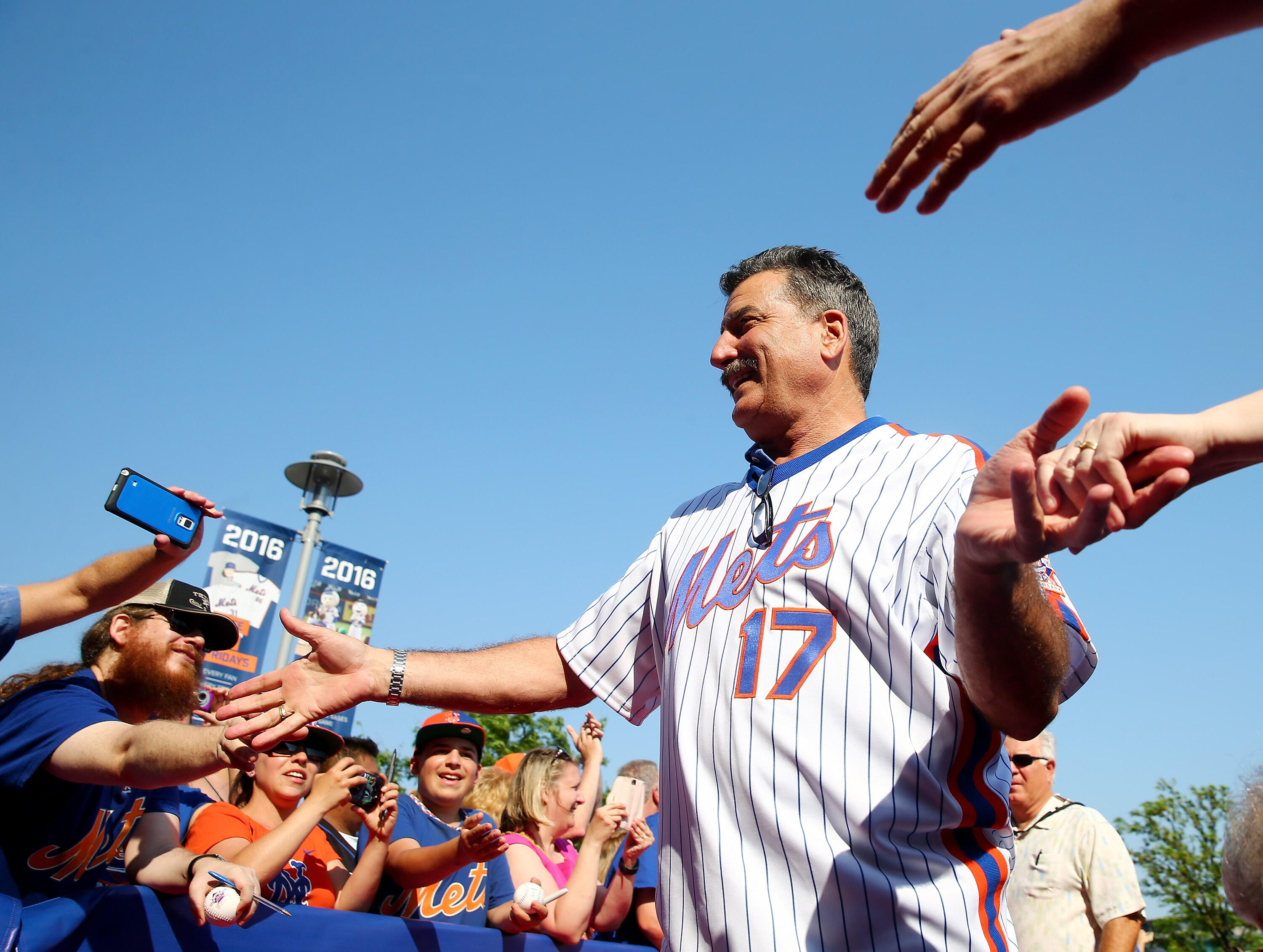 NEW YORK, NY - MAY 28:  Keith Hernandez #17 of the 1986 New York Mets greets the fans as he walks the red carpet before the game between the New York Mets and the Los Angeles Dodgers at Citi Field on May 28, 2016 in the Flushing neighborhood of the Queens