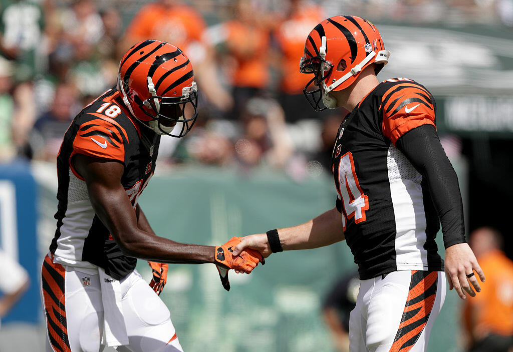 EAST RUTHERFORD, NJ - SEPTEMBER 11:  Temmates  Andy Dalton #14 of the Cincinnati Bengals and  A.J. Green #18 of the Cincinnati Bengals celebrate after scoring a touchdown against the New York Jets at MetLife Stadium on September 11, 2016 in East Rutherford, New Jersey.  (Photo by Streeter Lecka/Getty Images)