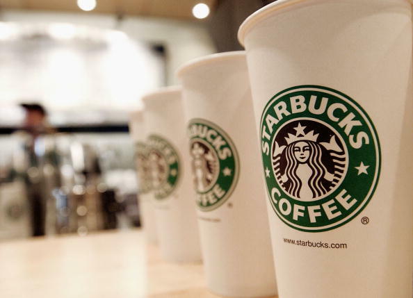 NEW YORK - AUGUST 5:  Beverage cups featuring the logo of Starbucks Coffee are seen in the new flagship store on 42nd Street August 5, 2003 in New York City. The Seattle-based coffee company has emerged as the largest food chain in the Manhattan borough o