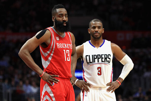 LOS ANGELES, CA - APRIL 10:  James Harden #13 of the Houston Rockets and Chris Paul #3 of the LA Clippers look on during the second  half of a game at Staples Center on April 10, 2017 in Los Angeles, California.  NOTE TO USER: User expressly acknowledges and agrees that, by downloading and or using this Photograph, user is consenting to the terms and conditions of the Getty Images License Agreement  (Photo by Sean M. Haffey/Getty Images)