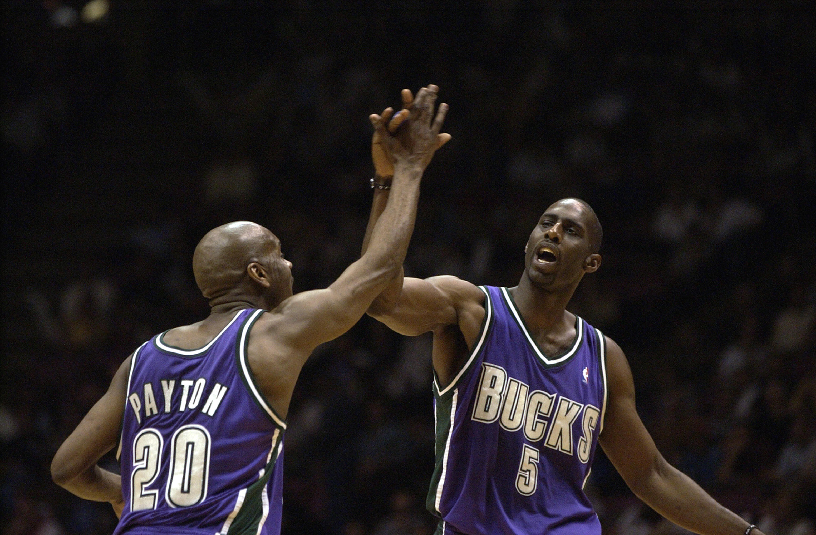 EAST RUTHERFORD, NJ - APRIL 22:  Gary Payton #20 and Tim Thomas #5 of the Milwaukee Bucks celebrate victory over the New Jersey Nets in Game two of the Eastern Conference Quarterfinals during the 2003 NBA Playoffs at Continental Airlines Arena on April 22