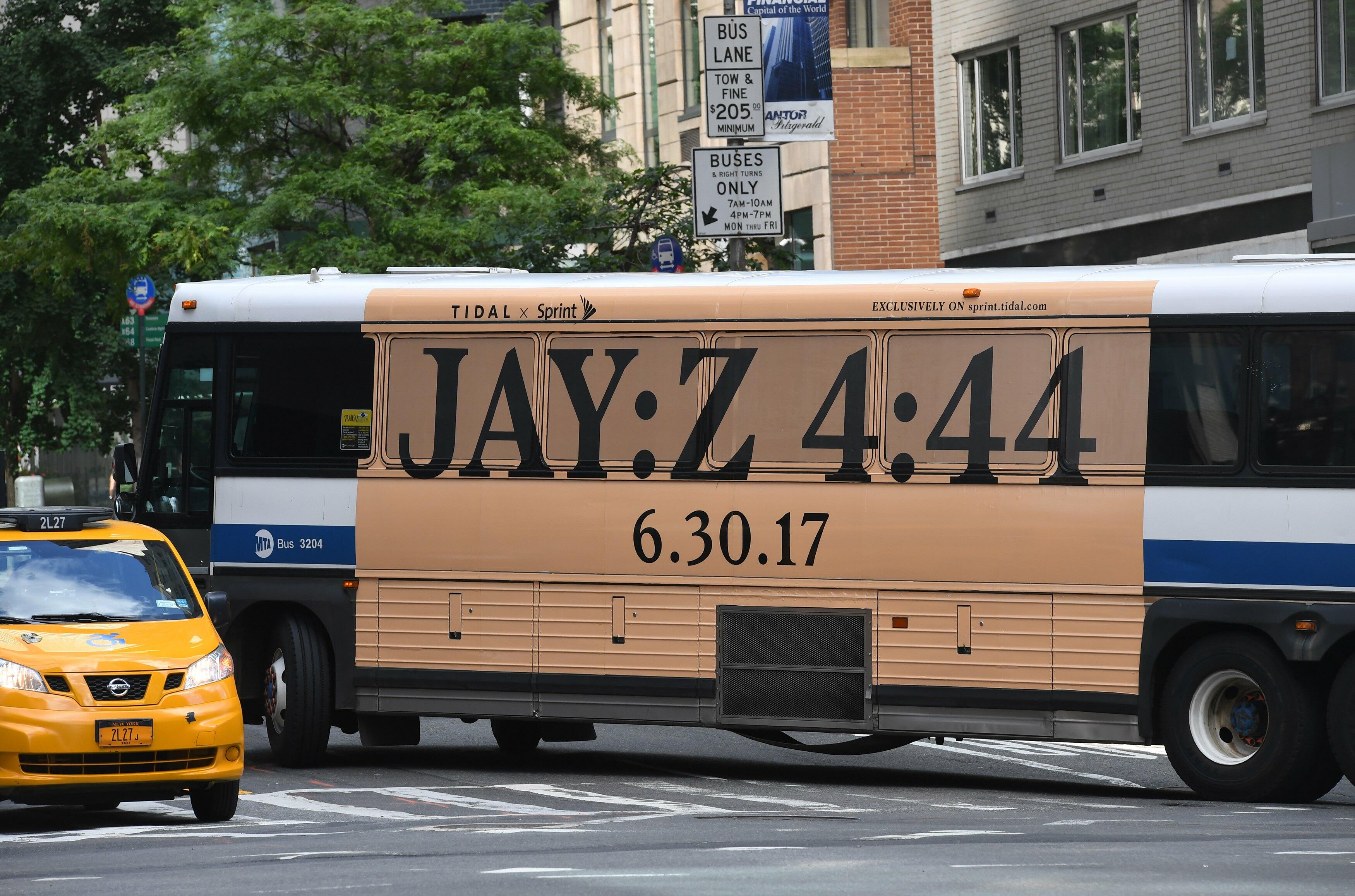 In this photo taken June 26, 2017, a New York City bus with an advertisement for Jay-Z's anticipated new album 