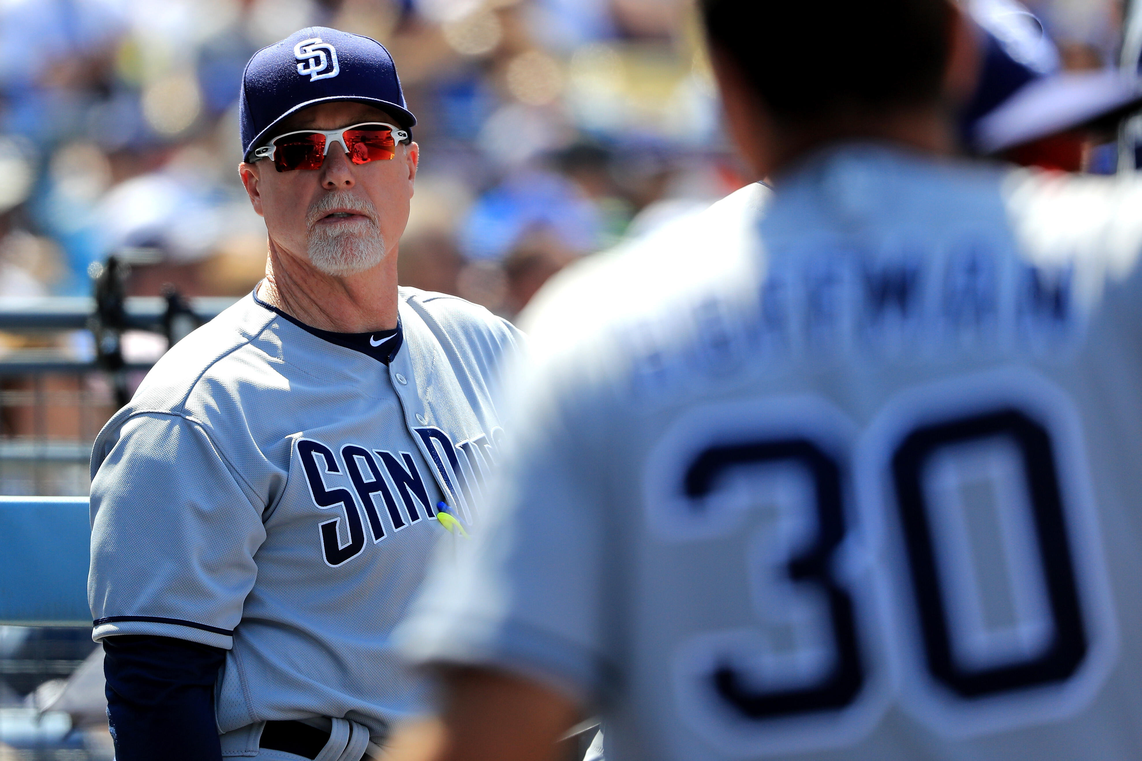 LOS ANGELES, CA - APRIL 03:  Bench Coach Mark McGwire of the San Diego Padres looks on during the fifth inning of an Opening Day game against the Los Angeles Dodgers at Dodger Stadium on April 3, 2017 in Los Angeles, California.  (Photo by Sean M. Haffey/