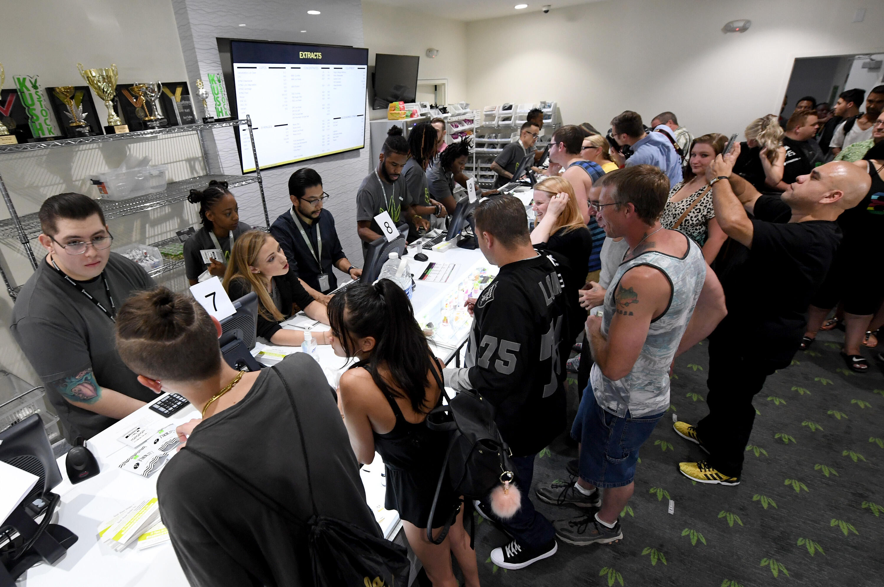LAS VEGAS, NV - JULY 01:  Customers buy cannabis products at Essence Vegas Cannabis Dispensary after the start of recreational marijuana sales began on July 1, 2017 in Las Vegas, Nevada. Nevada joins seven other states allowing recreational marijuana use 