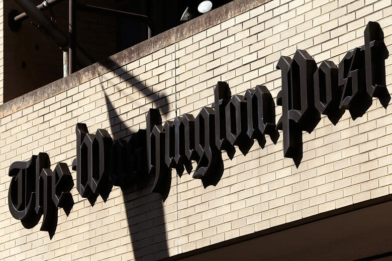 WASHINGTON, DC - SEPTEMBER 02:  A sign hangs on the Washington Post building September 2, 2014 in Washington, DC. It was announced that Frederick Ryan has been named the new publisher of the newspaper. Ryan, a founding member of the Politico website leade