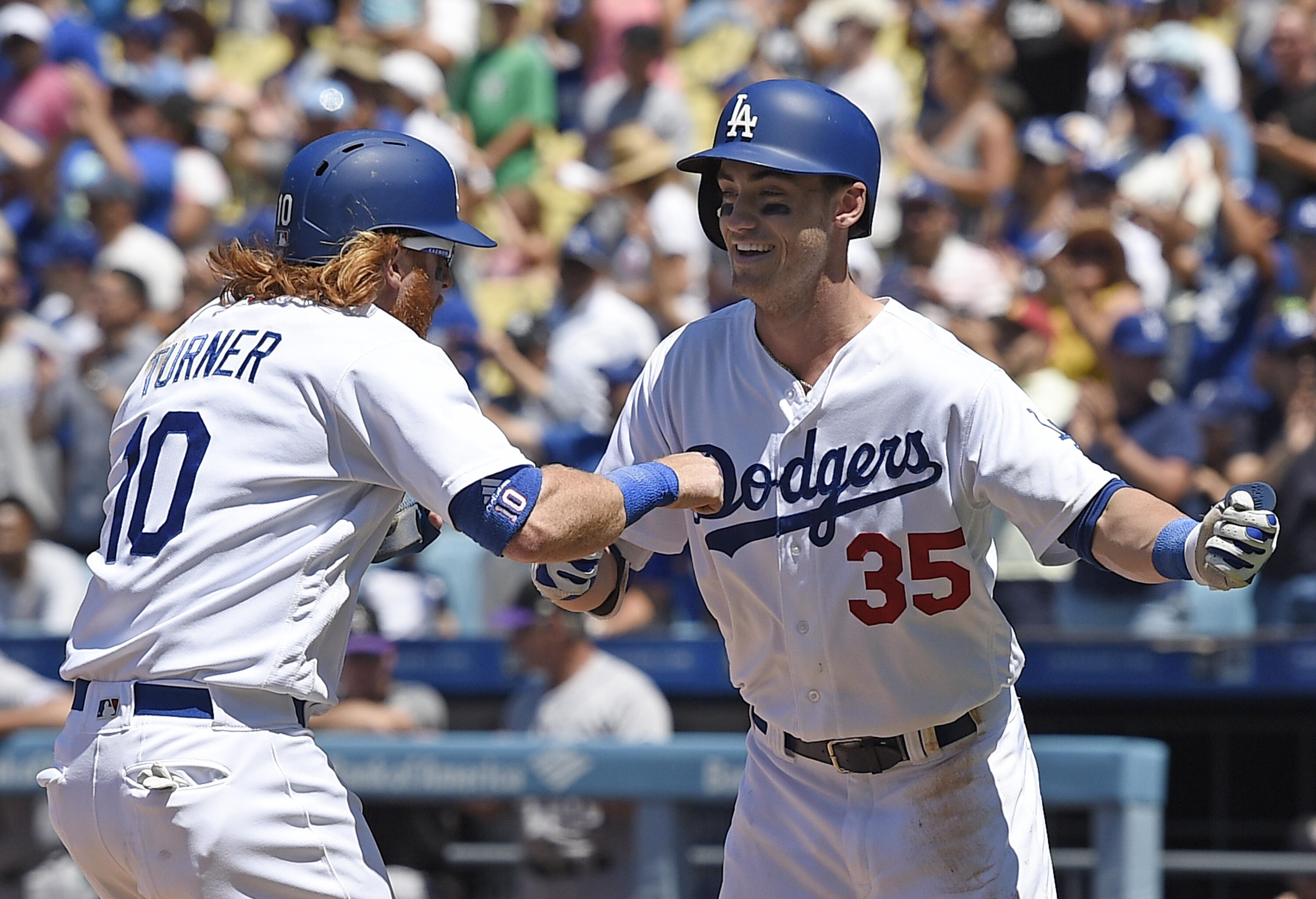 LOS ANGELES, CA - JUNE 25: Cody Bellinger #35 of the Los Angeles Dodgers celebrates his 23rd home run of the season  with Justin Turner #10 against Colorado Rockies during the third inning of the baseball game at Dodger Stadium June 25, 2017, in Los Angel