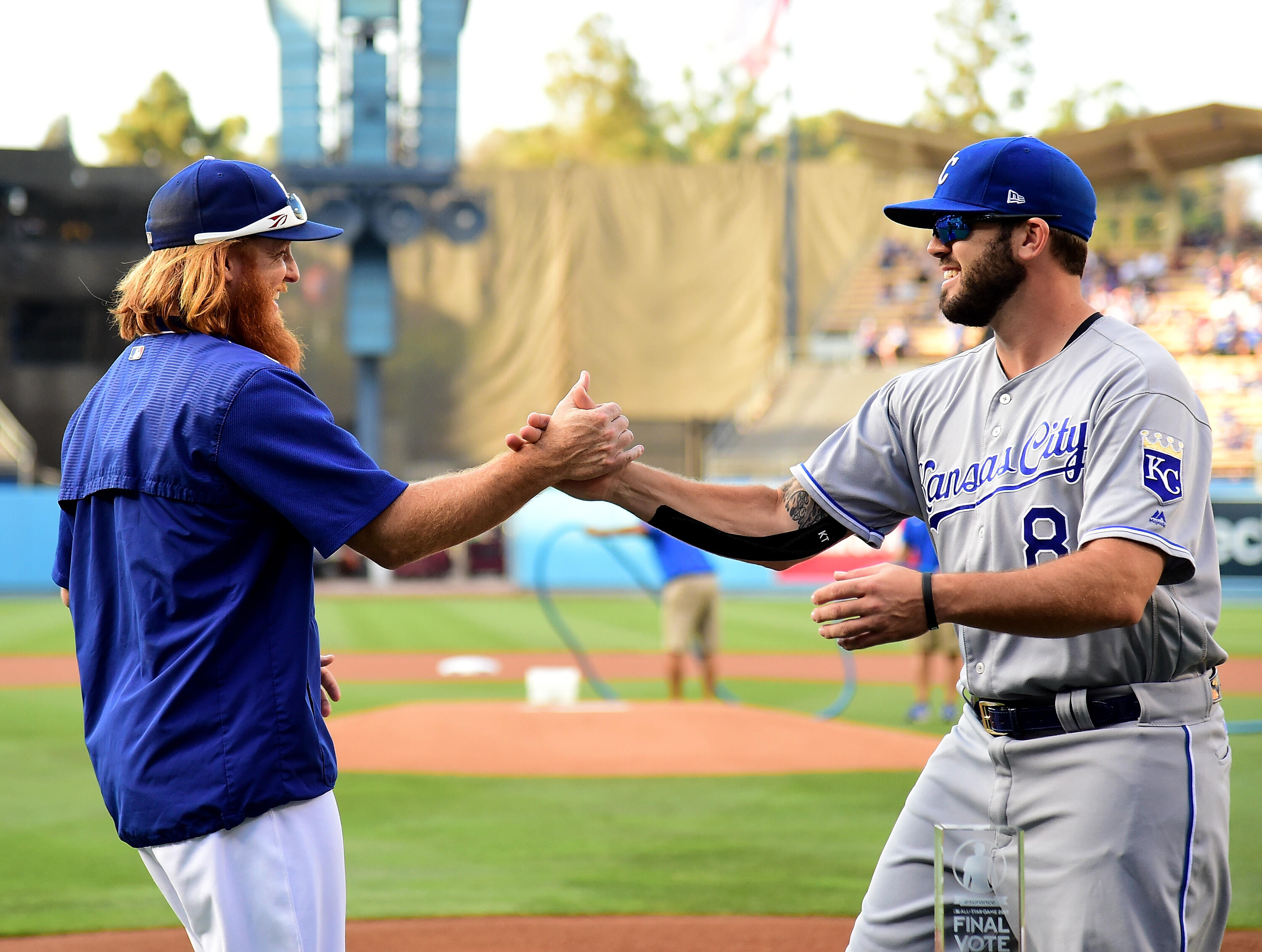 LOS ANGELES, CA - JULY 07:  Justin Turner #10 of the Los Angeles Dodgers and Mike Moustakas #8 of the Kansas City Royals shake hands befor posing for  photo with the MLB All Star Game 