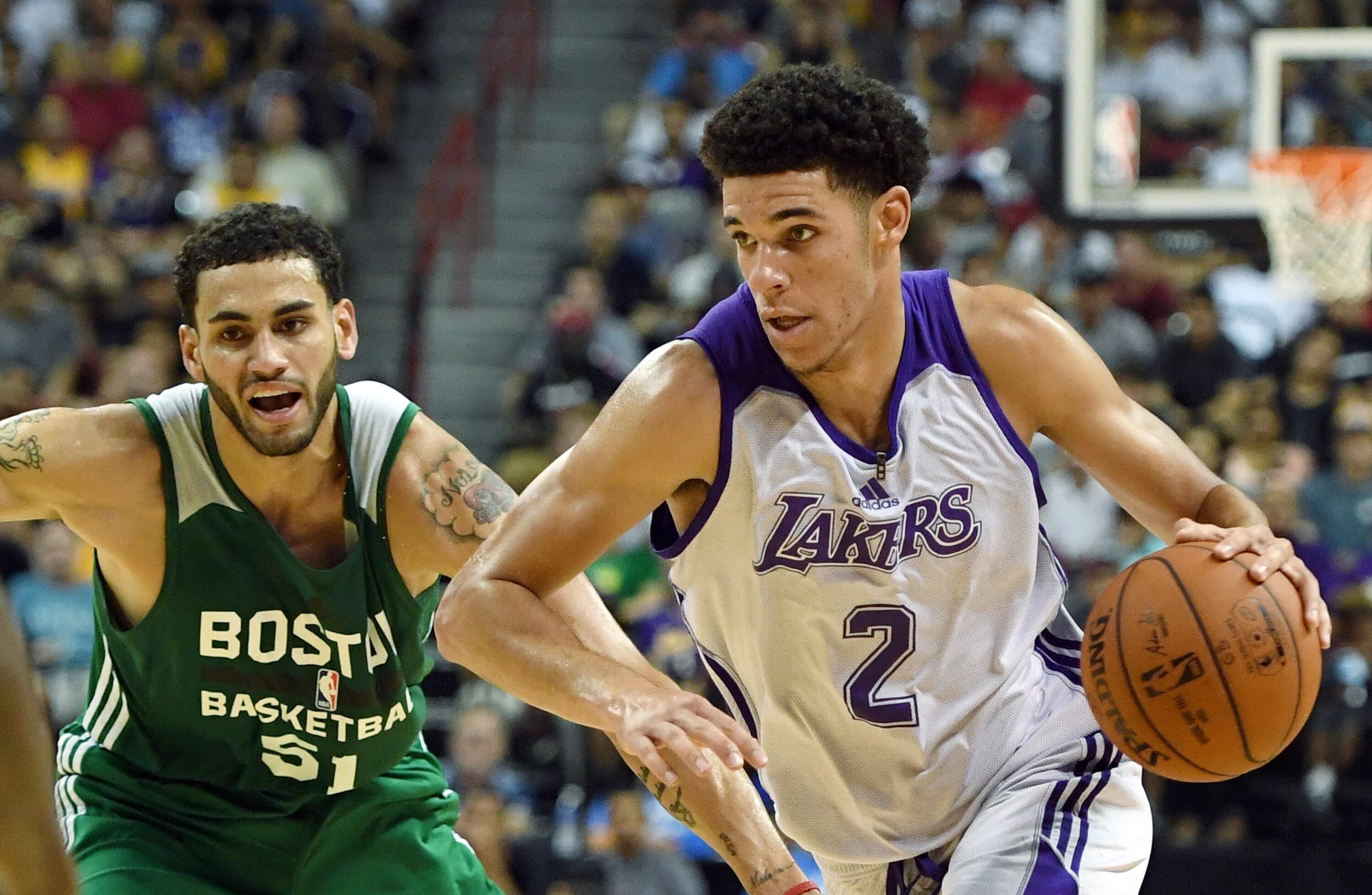 LAS VEGAS, NV - JULY 08:  Lonzo Ball #2 of the Los Angeles Lakers drives against Abdel Nader #51 of the Boston Celtics during the 2017 Summer League at the Thomas & Mack Center on July 8, 2017 in Las Vegas, Nevada. Boston won 86-81. NOTE TO USER: User exp