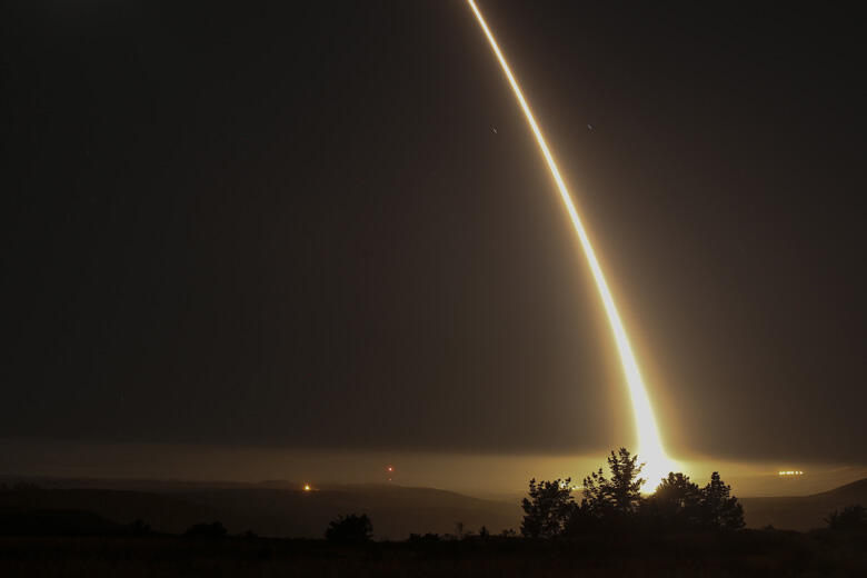 A streak of light trails off into the night sky as the US military test fires an unarmed intercontinental ballistic missile (ICBM) at Vandenberg Air Force Base, some 130 miles (209 kms) northwest of Los Angeles, California early on May 3, 2017. / AFP PHOT