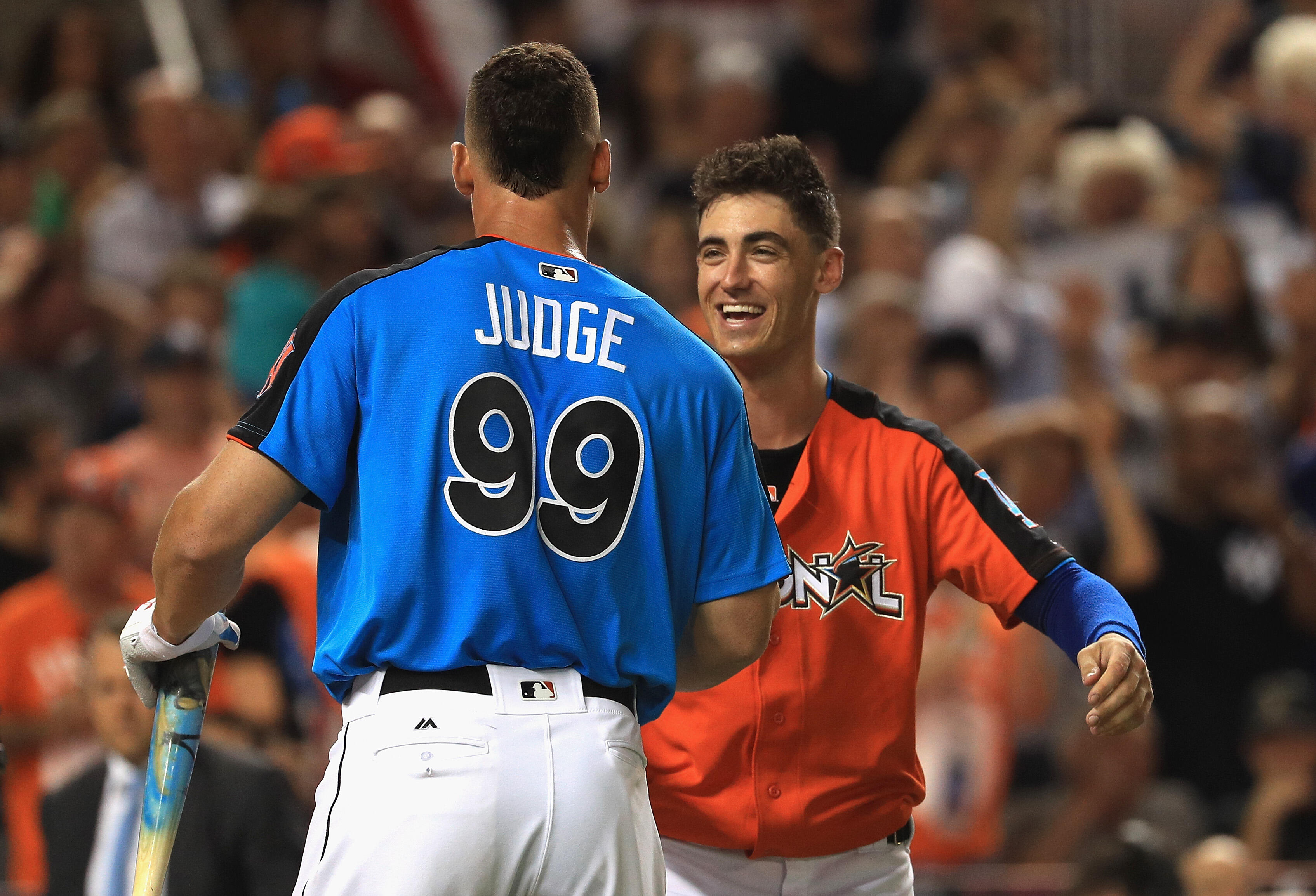 MIAMI, FL - JULY 10:  Aaron Judge #99 of the New York Yankees hugs Cody Bellinger #35 of the Los Angeles Dodgers and the National League during the T-Mobile Home Run Derby at Marlins Park on July 10, 2017 in Miami, Florida.  (Photo by Mike Ehrmann/Getty I
