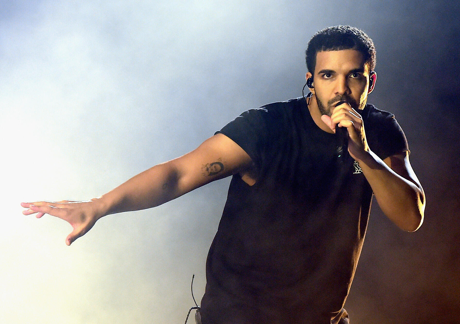 INDIO, CA - APRIL 12:  Rapper Drake performs onstage during day 3 of the 2015 Coachella Valley Music & Arts Festival (Weekend 1) at the Empire Polo Club on April 12, 2015 in Indio, California.  (Photo by Kevin Winter/Getty Images for Coachella)