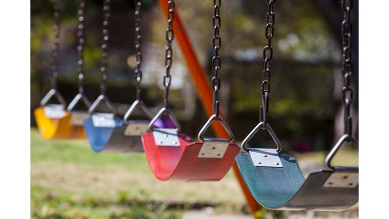 Empty colorful swings at the park