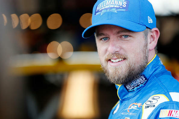 SPARTA, KENTUCKY - JULY 07:  Justin Allgaier, driver of the #7 Hellmann's Chevrolet, stands in the garage during practice for the NASCAR XFINITY Series Alsco 300 at Kentucky Speedway on July 7, 2017 in Sparta, Kentucky.  (Photo by Brian Lawdermilk/Getty Images)