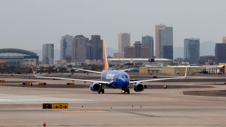A view of downtown Phoenix is seen from an an airplane on the tarmac of Phoenix airport on September 19, 2016. / AFP / Daniel SLIM        (Photo credit should read DANIEL SLIM/AFP/Getty Images)