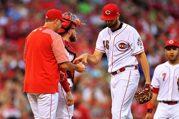 CINCINNATI, OH - JULY 14:  Pitcher Tim Adleman #46 of the Cincinnati Reds hands the ball to manager Bryan Price #38 of the Cincinnati Reds after being pulled in the fifth inning against the Washington Nationals at Great American Ball Park on July 14, 2017 in Cincinnati, Ohio. Washington shut out Cincinnati 5-0.  (Photo by Jamie Sabau/Getty Images)