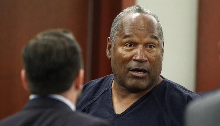 VEGAS, NV - MAY 17:  O.J. Simpson (R) stands at the end of an evidentiary hearing in Clark County District Court on May 17, 2013 in Las Vegas, Nevada. Simpson, who is currently serving a nine-to-33-year sentence in state prison as a result of his October 