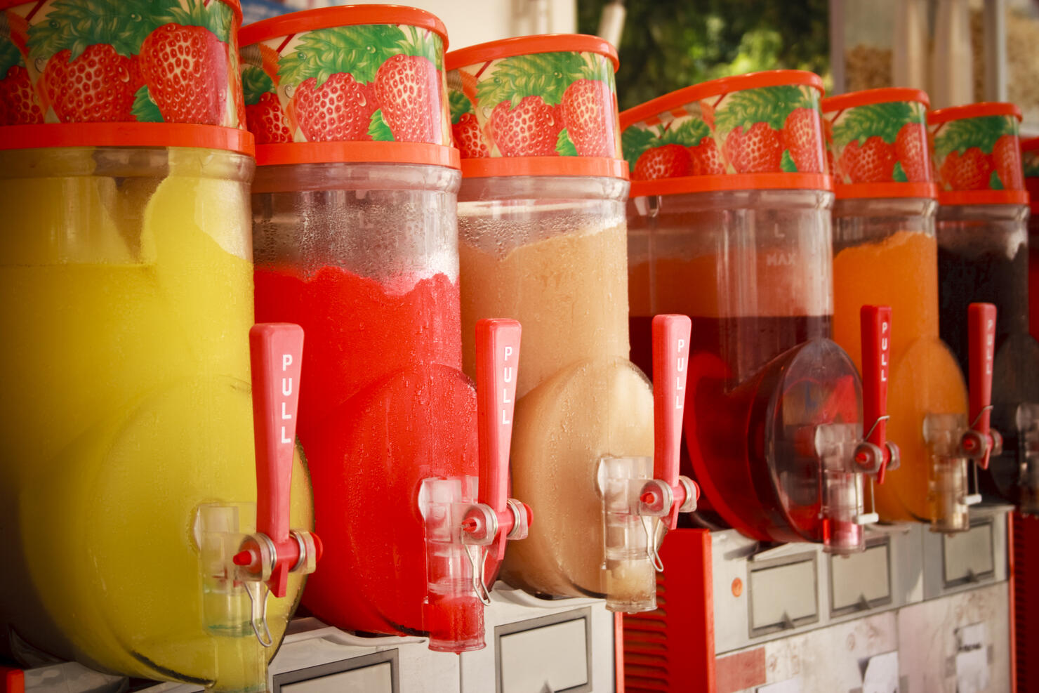 A slushie machine, filled with frozen Hennessy and Coke and frozen Grey Goose and lemonade