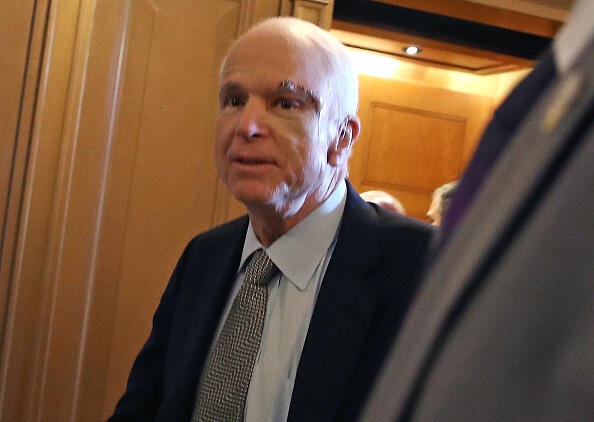 WASHINGTON, DC - JULY 25: Sen. John McCain (R-AZ) walks to the U.S. Senate chamber July 25, 2017, in Washington, DC. McCain was recently diagnosed with brain cancer but returned on the day the Senate is holding a key procedural vote on U.S. President Donald Trump's effort to repeal and replace the Affordable Care Act. (Photo by Mark Wilson/Getty Images)