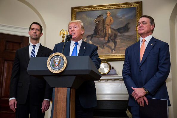 WASHINGTON, DC - AUGUST 2: (AFP OUT) U.S. President Donald Trump makes an announcement on the introduction of the Reforming American Immigration for a Strong Economy (RAISE) Act with Sen. Tom Cotton (R-AR) left, and Sen. David Perdue (R-GA) right, in the Roosevelt Room at the White House on August 2, 2017, in Washington, DC. The act aims to overhaul U.S. immigration by moving towards a 'merit-based' system. (Photo by Zach Gibson - Pool/Getty Images)