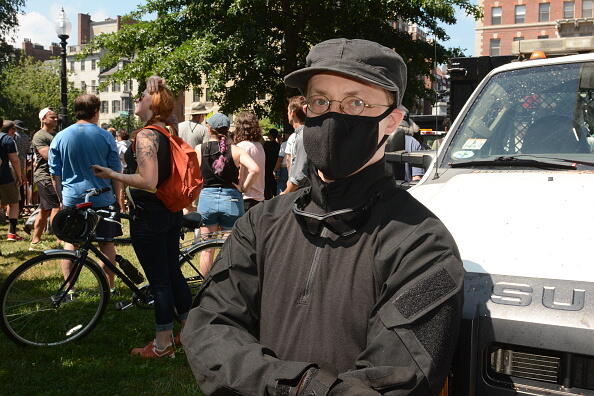 BOSTON, MA - AUGUST 19: A self-described Antifa member offers security. People participate in the Fight Supremacy! Boston Counter-Protest and Resistance rally on August 19, 2017 in Boston, Mass. People marched from the Roxbury neighborhood of the city to the Boston Commons where a 'Free Speech' rally was organized. The march, organized by Black Lives Matter and other groups, was in response to the violent events that took place in Charlottesville, VA., the week before. (Photo by Alfredo Sosa/The Christian Science Monitor via Getty Images)