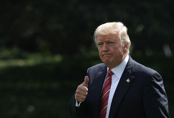 WASHINGTON, DC - AUGUST 25: U.S. President Donald Trump gives a thumbs up as he walks towards the Marine One on the South Lawn of the White House prior to a departure August 25, 2017, in Washington, DC. President Trump is spending the weekend with his family at Camp David. (Photo by Alex Wong/Getty Images)