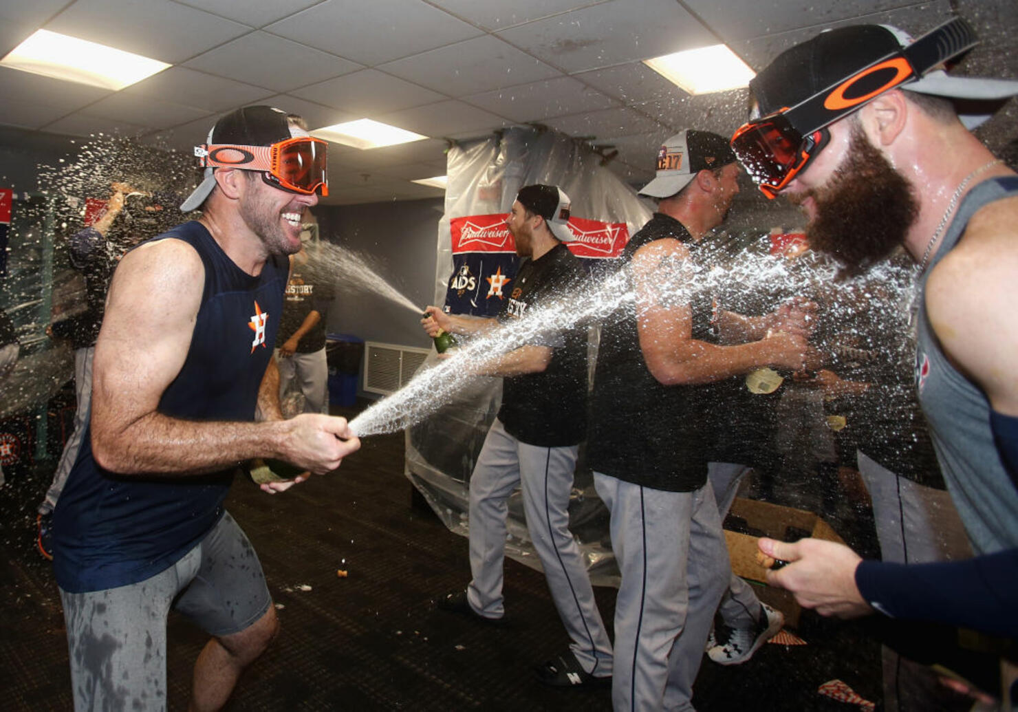 Justin Verlander #35 (L) celebrates with Dallas Keuchel #60 of the Houston Astros in the clubhouse 