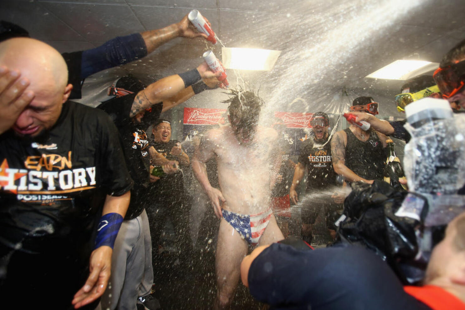 Josh Reddick #22 of the Houston Astros celebrates with teammates 