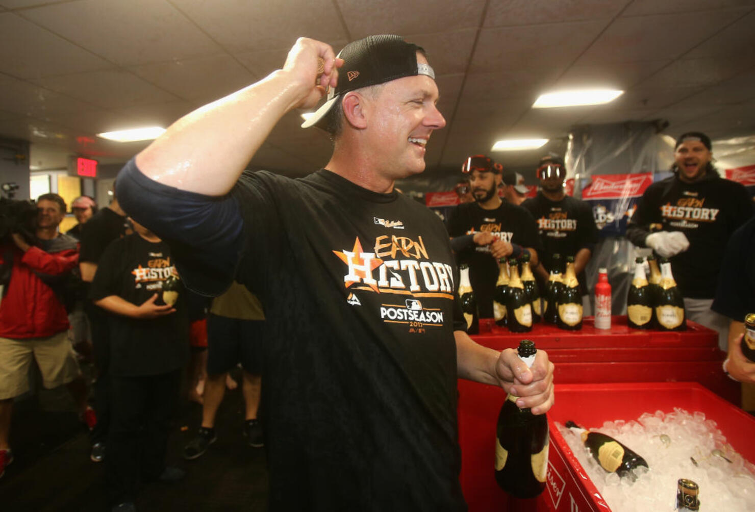 Manager A.J. Hinch of the Houston Astros celebrates in the clubhouse