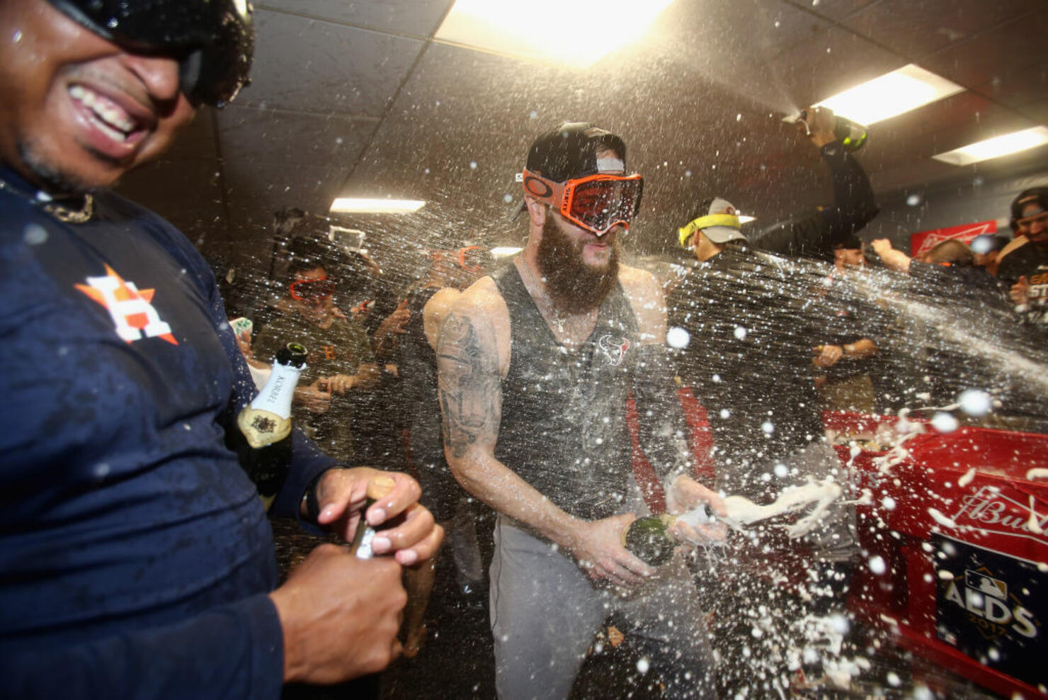 Dallas Keuchel #60 of the Houston Astros celebrates with teammates 