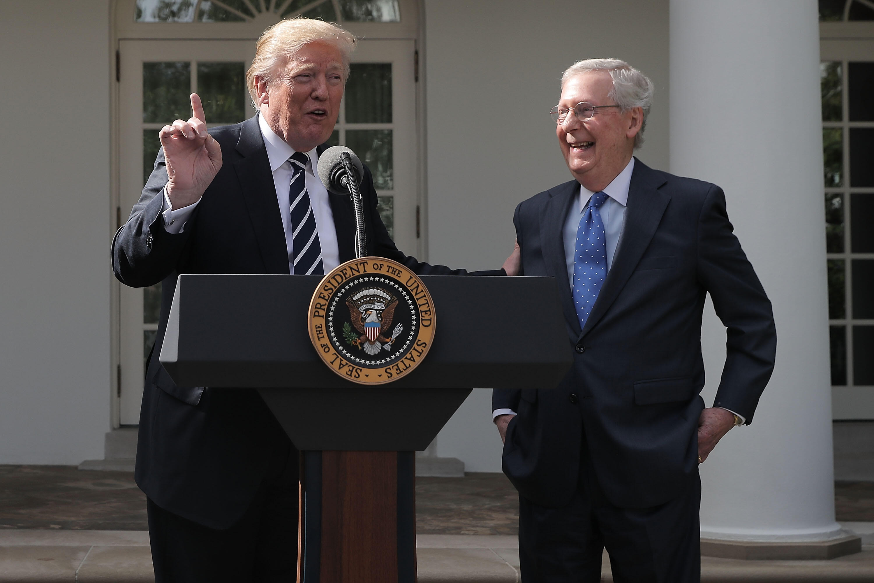 WASHINGTON, DC - OCTOBER 16: U.S. President Donald Trump (L) and Senate Majority Leader Mitch McConnell (R-KY) talk to reporters in the Rose Garden following a lunch meeting at the White House October 16, 2017, in Washington, DC. Trump and McConnell tried to erase reporting that they were not on the same page with the GOP legislative agenda and priorities. (Photo by Chip Somodevilla/Getty Images)