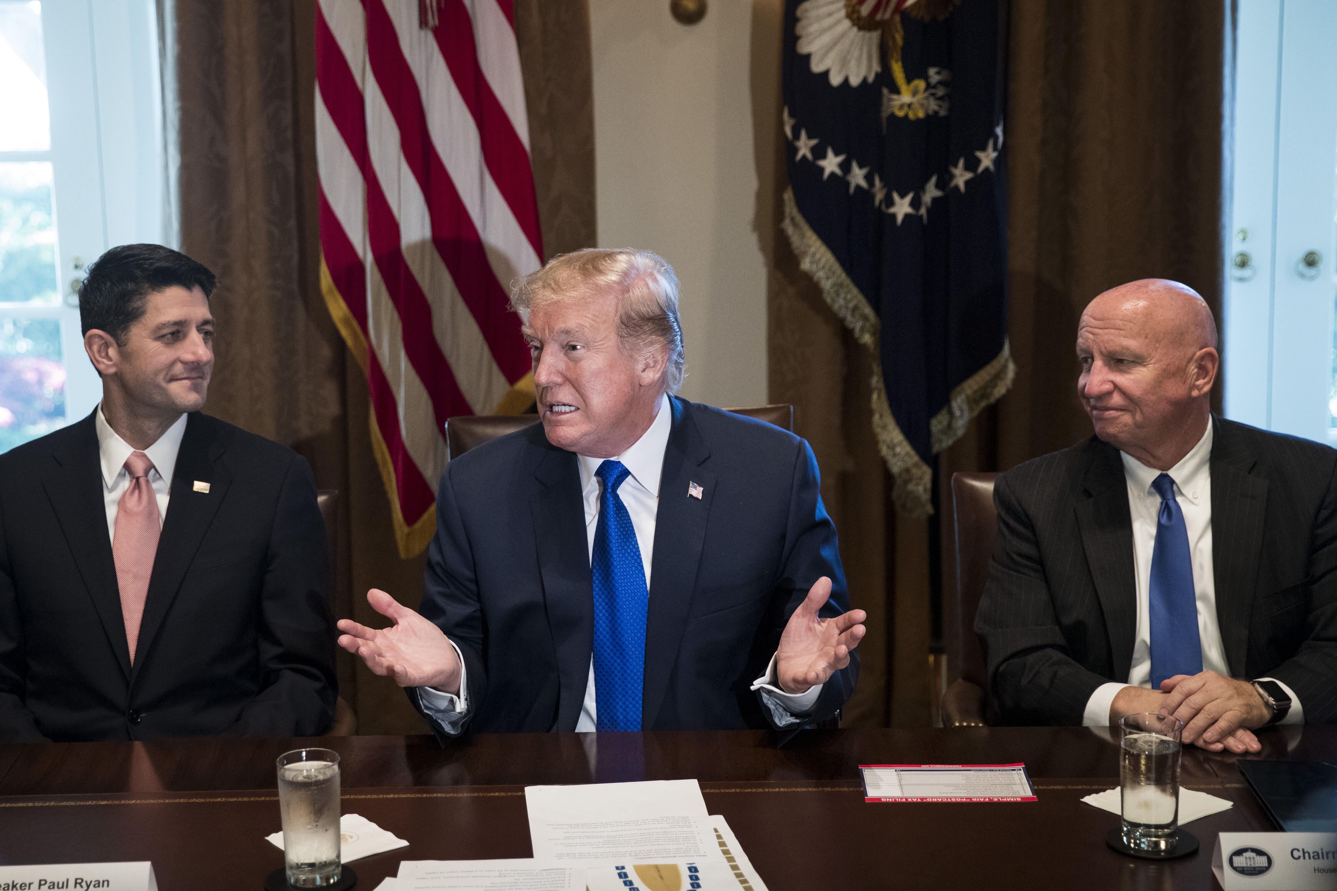 WASHINGTON, DC - NOVEMBER 02: Flanked by Speaker of the House Paul Ryan and House Ways and Means Committee chairman Rep. Kevin Brady (R-TX), President Donald Trump speaks about tax reform legislation during a meeting with members of the House Ways and Means Committee in the Cabinet Room at the White House, November 2, 2017 in Washington, DC. On Thursday, Republican lawmakers unveiled their plans for a massive rewrite of the U.S. tax code. (Drew Angerer/Getty Images)