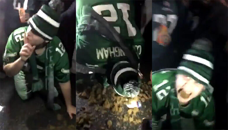 A happy (drunk?) Eagles fan eatshorse manure.