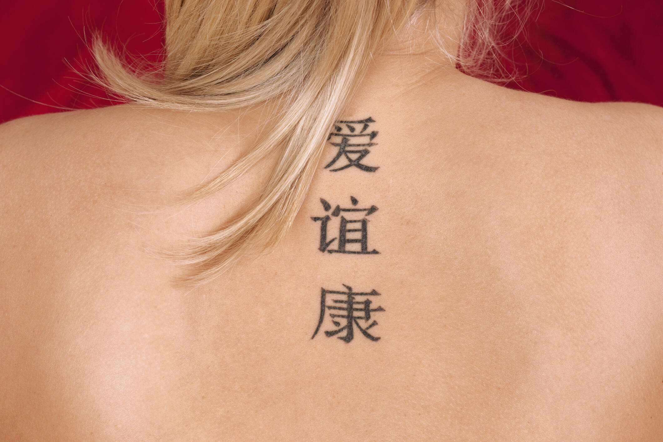 Woman's Tattoo Probably Doesn't Say What She Thinks It Does | iHeart