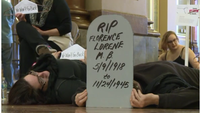 Pro-choice protesters lay on the Iowa State Capitol floor to demonstrate women who died getting illegal abortions. Photo WHO TV