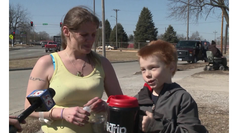 Melissa Farrell and 10-year-old Jesse Kaufman rescue neighbors. Photo by WHO TV