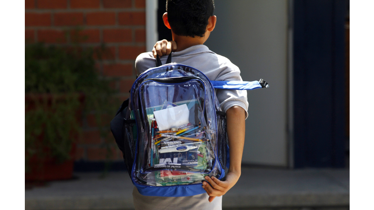 A secondary school student walks carrying a new transparent backpack in Guadalajara, Mexico on October 25, 2012. The transparent backpacks are part of the program 'Escuela Segura' (Safe School ) to avoid violence in schools and in the coming days the State Government will deliver 10,000 more of these hoping the measure will help teachers and parents see what students are taking to school. (Photo credit: HECTOR GUERRERO/AFP/Getty Images)