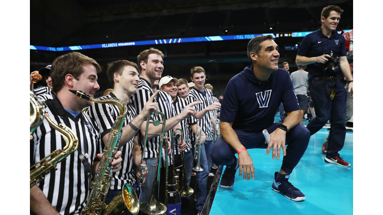 Head coach Jay Wright of the Villanova Wildcats speaks with the band during practice 