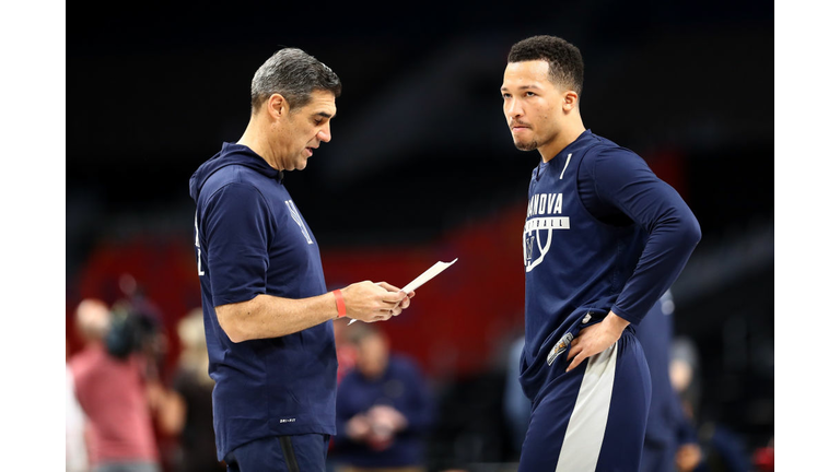 Jalen Brunson #1 of the Villanova Wildcats speaks to head coach Jay Wright 