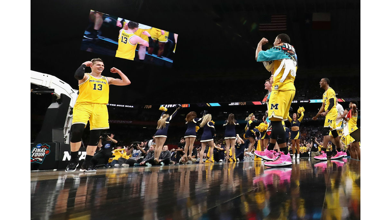Moritz Wagner #13 of the Michigan Wolverines celebrates 