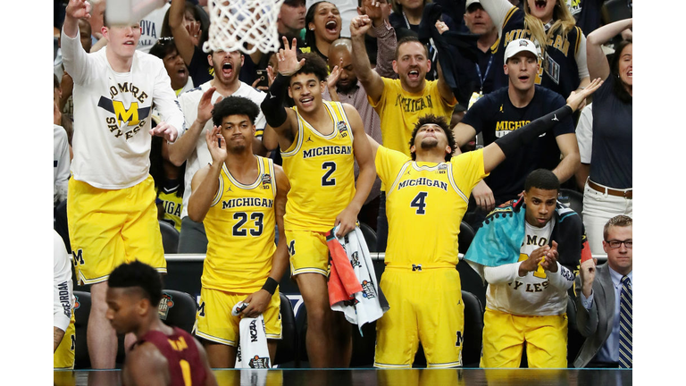 Jordan Poole #2 and Isaiah Livers #4 of the Michigan Wolverines 