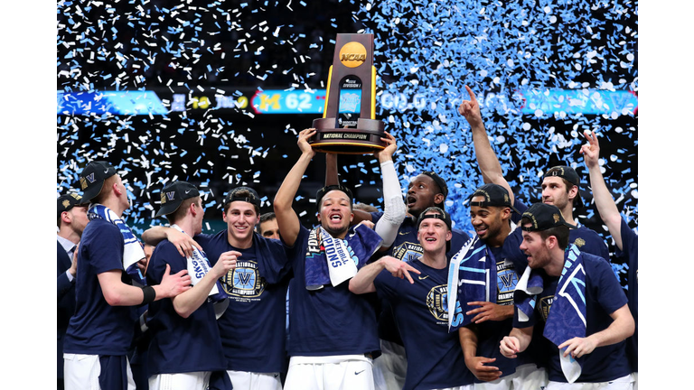 Jalen Brunson #1 of the Villanova Wildcats raises the trophy and celebrates 