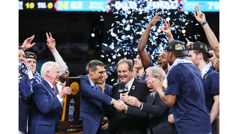 Head coach Jay Wright of the Villanova Wildcats is given the national championship trophy