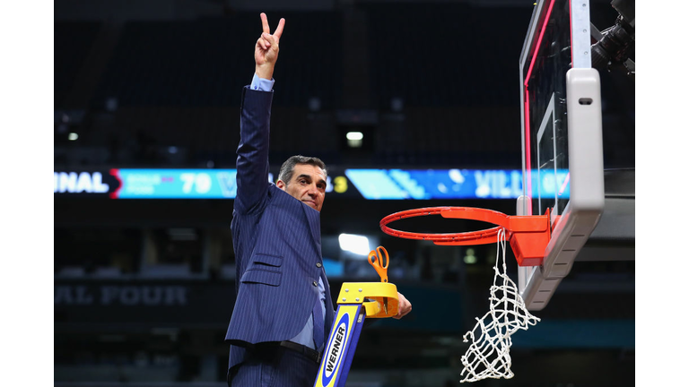 Head coach Jay Wright of the Villanova Wildcats cuts down the net