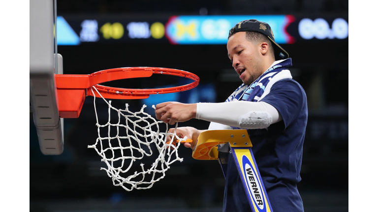 Jalen Brunson #1 of the Villanova Wildcats cuts down the net 